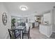 Bright, open-concept kitchen featuring stainless steel appliances, granite countertops, and a dining area at 400 E Baffin Dr, Venice, FL 34293