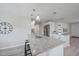 Kitchen features granite counters, stainless appliances, an island and pendant lighting at 400 E Baffin Dr, Venice, FL 34293