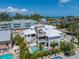 Aerial view of a luxurious home showcasing a sparkling pool and neighborhood at 401 39Th St, Holmes Beach, FL 34217