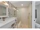 Modern bathroom showcasing a glass-enclosed shower, sleek vanity, and stylish tile accents at 401 39Th St, Holmes Beach, FL 34217