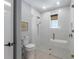 Modern bathroom with glass enclosed shower, sleek fixtures, and a neutral color palette at 401 39Th St, Holmes Beach, FL 34217