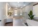 Contemporary bathroom featuring a double sink, glass shower, soaking tub and stylish fixtures at 401 39Th St, Holmes Beach, FL 34217