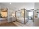 Bedroom featuring four poster bed, chandelier and attached bath with soaking tub at 401 39Th St, Holmes Beach, FL 34217