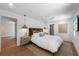 Spacious bedroom with pendant lights, a ceiling fan, and ensuite bathroom at 401 39Th St, Holmes Beach, FL 34217