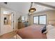 Inviting bedroom with stylish decor, a TV, and ensuite bathroom at 401 39Th St, Holmes Beach, FL 34217