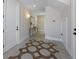 Inviting hallway featuring a decorative tile floor, sconces, and an elegant console table at 401 39Th St, Holmes Beach, FL 34217