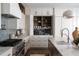 Modern kitchen featuring stainless steel appliances, custom cabinetry, and a spacious island at 401 39Th St, Holmes Beach, FL 34217