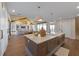 Well-appointed kitchen featuring a large island, modern lighting, and seamless access to living spaces at 401 39Th St, Holmes Beach, FL 34217