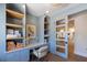 A laundry room with a desk, storage, and natural light at 401 39Th St, Holmes Beach, FL 34217