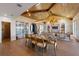 Bright living space featuring wood ceilings, hardwood floors, a custom wine fridge, and dining area at 401 39Th St, Holmes Beach, FL 34217