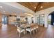 Bright living space featuring wood ceilings, hardwood floors, and an adjacent kitchen at 401 39Th St, Holmes Beach, FL 34217