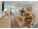 Inviting living room featuring stylish furniture, wood floors, an area rug, and natural lighting at 401 39Th St, Holmes Beach, FL 34217