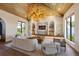 Open-plan living space with vaulted wood ceilings, recessed lighting, and luxury decor at 401 39Th St, Holmes Beach, FL 34217