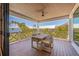 Inviting outdoor dining area with seating for six and lush tropical surroundings at 401 39Th St, Holmes Beach, FL 34217