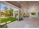 Spacious outdoor living area leading to a lush yard, pool, and inviting jacuzzi at 401 39Th St, Holmes Beach, FL 34217