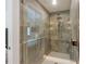 Modern shower features stunning tile work and glass door at 401 39Th St, Holmes Beach, FL 34217
