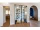 An indoor wine cellar featuring glass doors and black racking at 401 39Th St, Holmes Beach, FL 34217