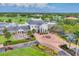 Beautiful aerial view of the country club featuring a golf course, manicured landscaping, and stunning architecture at 401 N Point Rd # 504, Osprey, FL 34229