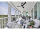 Spacious balcony with fan and furniture providing a comfortable outdoor living area with views at 401 N Point Rd # 504, Osprey, FL 34229