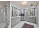 Bathroom featuring a double vanity, granite countertops, decorative wallpaper, and a walk-in shower at 401 N Point Rd # 504, Osprey, FL 34229