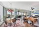 Open dining area with views, a glass table, and a chandelier, creating an elegant space for entertaining at 401 N Point Rd # 504, Osprey, FL 34229