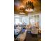Elegant dining room features a wine display, stylish chairs and custom lighting fixtures at 401 N Point Rd # 504, Osprey, FL 34229