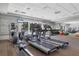 Spacious gym with modern equipment, including treadmills and elliptical machines, for a healthy lifestyle at 401 N Point Rd # 504, Osprey, FL 34229