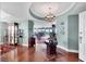 Elegant condo hallway with hardwood floors, decorative accents, and open view to the living area at 401 N Point Rd # 504, Osprey, FL 34229