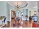 Grand condo hallway with hardwood floors, elegant decor, and soft, welcoming lighting at 401 N Point Rd # 504, Osprey, FL 34229