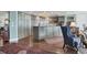 Spacious condo kitchen with island, stainless steel appliances, and hardwood flooring at 401 N Point Rd # 504, Osprey, FL 34229