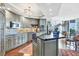 Modern kitchen with stainless steel appliances, granite countertops, and decorative backsplash at 401 N Point Rd # 504, Osprey, FL 34229