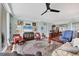 Bright living room featuring hardwood floors, stylish furnishings, and ample space for relaxation and entertainment at 401 N Point Rd # 504, Osprey, FL 34229