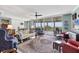 Bright and open living room with hardwood floors, large windows, and views of the outdoors at 401 N Point Rd # 504, Osprey, FL 34229