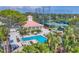 Resort-style pool area surrounded by lush tropical landscaping, offering a serene and private oasis at 401 N Point Rd # 504, Osprey, FL 34229