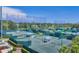 Multiple well-maintained tennis courts surrounded by lush greenery, perfect for recreational play at 401 N Point Rd # 504, Osprey, FL 34229