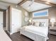 Bright bedroom with vaulted ceilings and hardwood floors at 421 Alamanda Rd, Anna Maria, FL 34216
