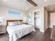 Bright bedroom featuring vaulted ceilings and hardwood floors at 421 Alamanda Rd, Anna Maria, FL 34216