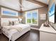 Bright bedroom with vaulted ceilings and hardwood floors at 421 Alamanda Rd, Anna Maria, FL 34216
