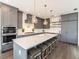 Kitchen with a center island, gray cabinets, and stainless steel appliances at 421 Alamanda Rd, Anna Maria, FL 34216