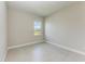 A sunny, empty bedroom with a big window looking over a green landscape and blue skies at 4210 Sea Marsh Pl, Parrish, FL 34219