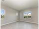 Bedroom with tile flooring and windows overlooking picturesque scenery at 4210 Sea Marsh Pl, Parrish, FL 34219
