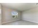 Bright bedroom with a large window offering backyard view at 4210 Sea Marsh Pl, Parrish, FL 34219