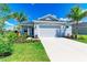 Attractive single-Gathering home boasting a lush green lawn, enhanced by landscaping and a spacious driveway at 4210 Sea Marsh Pl, Parrish, FL 34219