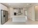 Well-appointed kitchen featuring sleek stainless steel appliances, a functional island, and ample counter space at 4210 Sea Marsh Pl, Parrish, FL 34219
