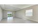 Bright living room with sliding glass doors leading to outdoor view at 4210 Sea Marsh Pl, Parrish, FL 34219