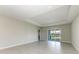 Spacious living room featuring tile flooring and sliding glass doors to backyard at 4210 Sea Marsh Pl, Parrish, FL 34219