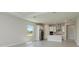 Open concept living area leading to kitchen featuring stainless steel appliances and island at 4210 Sea Marsh Pl, Parrish, FL 34219