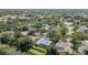 Stunning aerial view of a neighborhood with mature trees, water features and well-maintained homes at 4374 Indian Point Trl, Sarasota, FL 34238