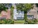 Aerial view of the house with a pool, well-maintained landscaping, and roof at 4374 Indian Point Trl, Sarasota, FL 34238