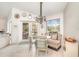 Cozy breakfast nook with ample lighting, designer chairs, views of the exterior, and stylish chandelier at 4374 Indian Point Trl, Sarasota, FL 34238